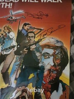 Livre d'affiches de Dawn of the Dead de 1978, signé 2 fois par Tom Savini et 1 fois par David Emge